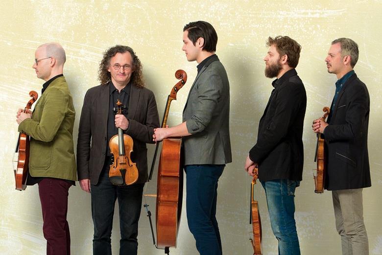 Violin player Colin Jacobsen (far right) with Brooklyn Rider and Irish fiddler Martin Hayes (second from left)